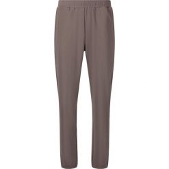 Damskie spodnie dresowe Athlecia Guyana. Brązowe spodnie sportowe damskie Athlecia, z dresówki, na fitness i siłownię. Za 189.50 zł.