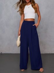 Milan Kiss Spodnie w kolorze granatowym rozmiar: S. Niebieskie spodnie materiałowe damskie Milan Kiss, bez wzorów, z materiału, z podwyższonym stanem. Za 152.99 zł.