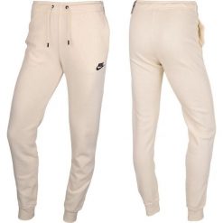 Spodnie Sportowe damskie Nike. Brązowe spodnie dresowe damskie Nike, xl. Za 239.71 zł.
