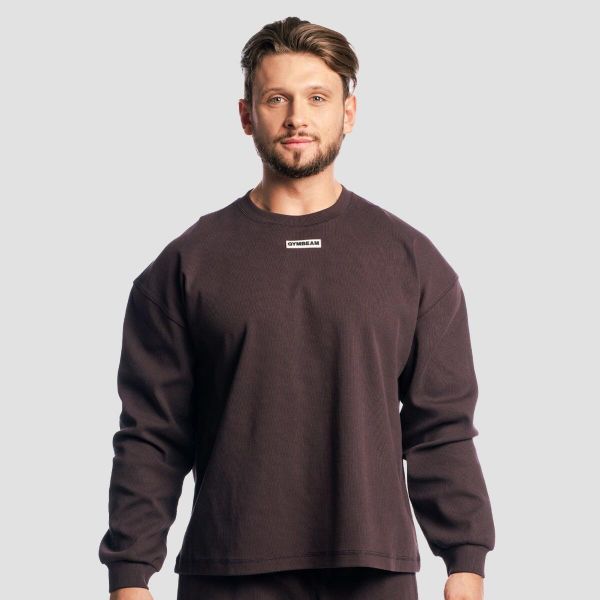 Bluza męska oversize bez kaptura brązowa Aura Tee. Brązowe bluzy sportowe męskie GYMBEAM, bez wzorów, z bawełny, wakacyjne, bez kołnierzyka, bez ramiączek. Za 131.90 zł.