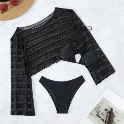 Komplet plażowy z ażurową narzutką i bikini na lato Tressa. Czarne bikini damskie Intica, w ażurowe wzory. W wyprzedaży za 169.00 zł.