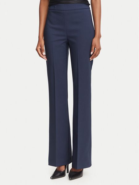 Rinascimento Spodnie materiałowe CFC0130135003 Granatowy Flare Fit. Niebieskie spodnie materiałowe damskie RINASCIMENTO, bez wzorów, z materiału. Za 469.99 zł.