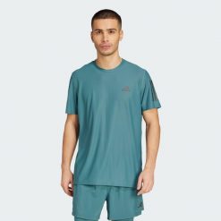 Koszulka Own The Run. Niebieskie t-shirty sportowe męskie Adidas, xs, z materiału, bez ramiączek, do biegania. Za 149.00 zł.