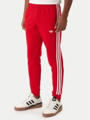 Adidas Spodnie dresowe 3-Stripes KE3560 Czerwony Slim Fit. Czerwone spodnie dresowe męskie Adidas, bez wzorów, z dresówki. Za 259.99 zł.