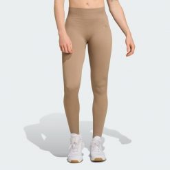 Długie dzianinowe legginsy do ćwiczeń Essentials. Zielone legginsy damskie Adidas, xs, bez wzorów, z dzianiny. Za 217.30 zł.