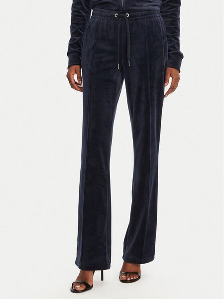 Juicy Couture Spodnie dresowe Tina JCAPW045 Granatowy Regular Fit. Niebieskie spodnie dresowe damskie Juicy Couture, l, bez wzorów, z dresówki. Za 309.99 zł.