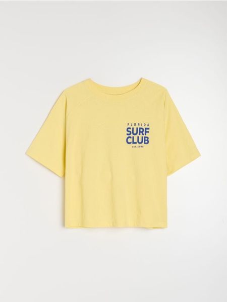 Bawełniana koszulka z napisem Surf Club - yellow jeans. Żółte t-shirty damskie Sinsay, l, bez wzorów, z bawełny, bez kołnierzyka. W wyprzedaży za 9.99 zł.