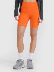 4F Szorty funkcyjne w kolorze pomarańczowym rozmiar: L. Pomarańczowe spodenki sportowe damskie 4f, l, z materiału, na fitness i siłownię. Za 109.95 zł.
