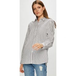 Tommy Jeans - Koszula. Białe koszule damskie Tommy Jeans, s, bez wzorów, z bawełny, casualowe, bez kołnierzyka, bez ramiączek. W wyprzedaży za 259.90 zł.