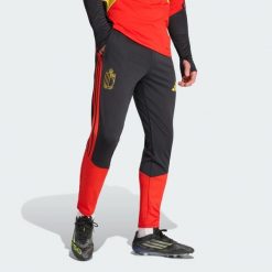 Spodnie treningowe Belgium 26 Tiro. Czarne spodnie materiałowe męskie Adidas, bez wzorów, sportowe. Za 279.00 zł.
