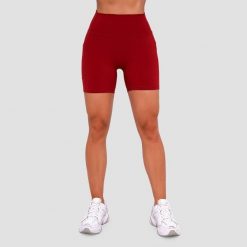Szorty damskie fitness slim z kieszeniami czerwone Ignite. Czerwone spodenki sportowe damskie GYMBEAM, bez wzorów, z elastanu, sportowe. Za 85.90 zł.