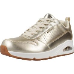 Buty SKECHERS UNO - METALLIXS Złoty. Żółte buty sportowe na co dzień damskie Skechers, bez wzorów, ze skóry ekologicznej. Za 446.09 zł.