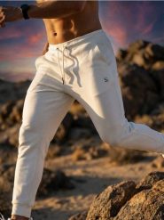 Spodnie tapered fit - biały. Białe spodnie materiałowe męskie Sinsay, bez wzorów. Za 59.99 zł.