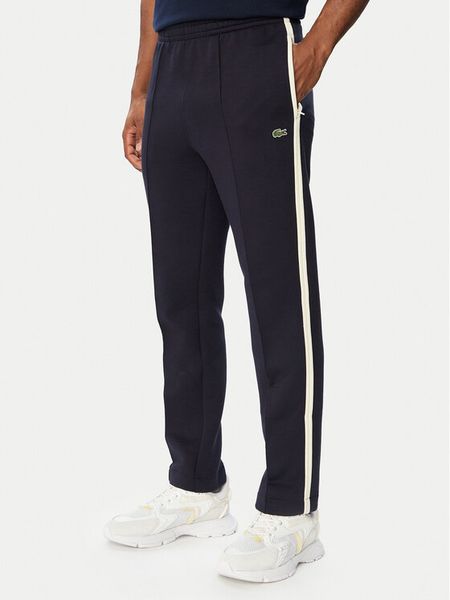 Lacoste Spodnie dresowe XH8615 Granatowy Regular Fit. Niebieskie spodnie dresowe męskie Lacoste, bez wzorów, z bawełny. Za 769.99 zł.