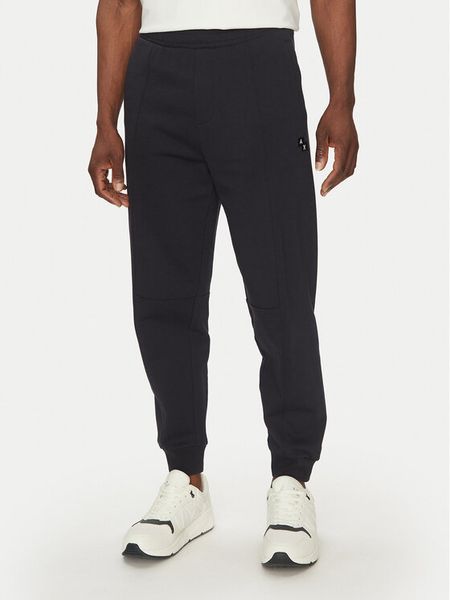 Armani Exchange Spodnie dresowe XM000472 AF13109 UB101 Granatowy Regular Fit. Niebieskie spodnie dresowe męskie Armani Exchange, bez wzorów, z bawełny. Za 609.99 zł.