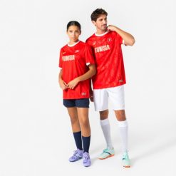 Koszulka piłkarska dla kibiców Tunezja 2026. Czerwone t-shirty damskie KIPSTA, m, z materiału, bez ramiączek, do piłki nożnej. Za 44.99 zł.