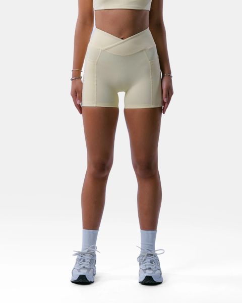 Damskie szorty z wysokim stanem i kieszenią fitness – Encore – Butter. Żółte spodenki sportowe damskie AESTHETICWOLF, bez wzorów, z dzianiny, z podwyższonym stanem. Za 189.99 zł.