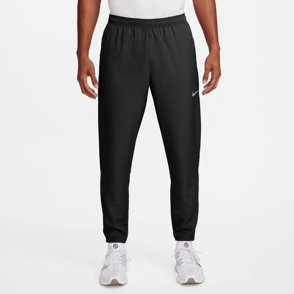 Męskie spodnie M NK DF CHALLENGR WVN PANT. Czarne spodnie materiałowe męskie Nike, bez wzorów, z materiału, klasyczne. Za 337.95 zł.