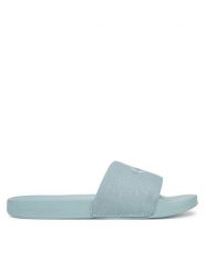 Calvin Klein Jeans Klapki Slide Monogram Wn YW0YW01835 Niebieski. Niebieskie klapki damskie Calvin Klein Jeans, bez wzorów, z jeansu, bez obcasa. Za 99.99 zł.