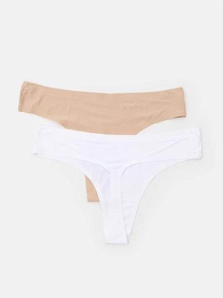 Bezszwowe stringi typu tanga 2 pack - biały. Białe stringi damskie Sinsay, l, bez wzorów. Za 12.99 zł.
