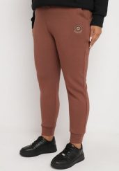 Ciemnobrązowe Klasyczne Spodnie Dresowe o Kroju Joggerów Lerive. Brązowe spodnie dresowe damskie Born2be, xl, bez wzorów, z dresówki. Za 44.99 zł.