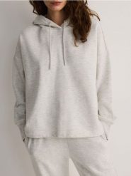 Bluza z kapturem - jasnoszary. Szare bluzy z kapturem damskie Reserved, l, z bawełny. W wyprzedaży za 69.99 zł.