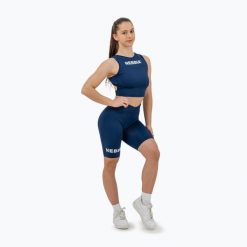 Top treningowy damski NEBBIA Gym Therapy Cropped. Niebieskie topy sportowe damskie Nebbia, bez wzorów, bez ramiączek. Za 159.99 zł.