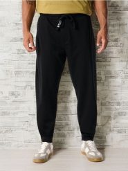 Spodnie dresowe jogger - czarny. Czarne spodnie sportowe męskie Sinsay, z bawełny. Za 29.99 zł.