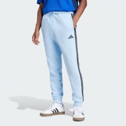 Spodnie Essentials 3-Stripes Fleece. Czarne spodnie sportowe męskie Adidas, z materiału. Za 174.99 zł.