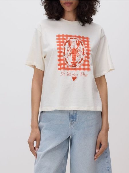 Bawełniany t-shirt z nadrukiem - kremowy. Białe t-shirty damskie Reserved, l, bez wzorów, z bawełny, bez kołnierzyka. W wyprzedaży za 22.99 zł.