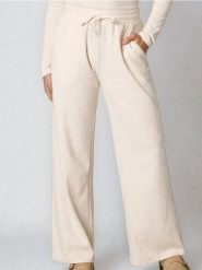 Spodnie wide leg basic - kremowy. Białe spodnie materiałowe damskie Sinsay, bez wzorów. Za 49.99 zł.