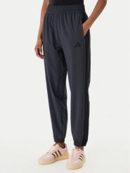 Adidas Spodnie dresowe Train Essentials 3-Stripes Woven KC5496 Czarny Regular Fit. Czarne spodnie dresowe damskie Adidas, s, z dresówki, na fitness i siłownię. Za 219.99 zł.