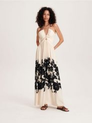 Sukienka z kwiatowym printem - wielobarwny. Sukienki damskie Reserved, l, bez wzorów, z tkaniny, bez kołnierzyka, bez ramiączek. W wyprzedaży za 69.99 zł.