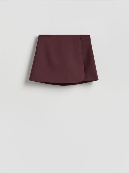 Spódnico-szorty z dodatkiem wiskozy - bordowy. Czerwone szorty damskie Reserved, bez wzorów, z tkaniny. Za 119.99 zł.