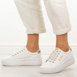 Białe trampki damskie Lee Cooper 4478. Białe trampki i tenisówki damskie Lee Cooper, bez wzorów, z gumy. Za 139.00 zł.
