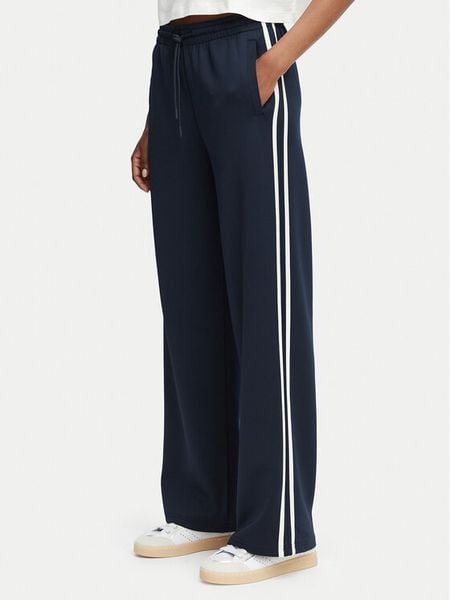 Guess Spodnie dresowe V6YB08 K4286 Granatowy Regular Fit. Niebieskie spodnie dresowe damskie Guess, xl, z aplikacjami, z dresówki. Za 390.99 zł.