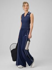 4F Spodnie dresowe z szerokimi nogawkami damskie - granatowe L. Niebieskie spodnie dresowe damskie 4f, l, bez wzorów, z bawełny. Za 159.99 zł.