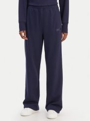 DKNY Sport Spodnie dresowe DP6P3795 Granatowy Regular Fit. Niebieskie spodnie sportowe damskie DKNY Sport, xl, z bawełny. Za 309.99 zł.