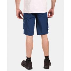 Szorty Kilpi Asher. Niebieskie szorty męskie Kilpi, na lato, bez wzorów, z materiału, sportowe. Za 215.49 zł.