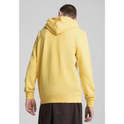 Męska bluza z kapturem Essentials z dwukolorowym logo No. 1 PUMA Sunny Yellow. Żółte bluzy z kapturem męskie Puma, m, z gumy. Za 207.65 zł.