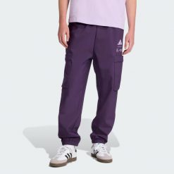 Spodnie Mercedes - Amg Petronas Formula One Team Premium Woven. Fioletowe spodnie materiałowe męskie Adidas, bez wzorów, z materiału. W wyprzedaży za 359.25 zł.
