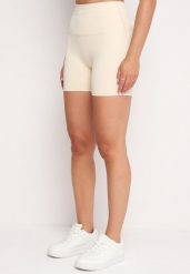 Jasnobeżowe Szorty Kolarki przed Kolano w Sportowym Stylu z Efektem Push Up Vesna. Brązowe spodenki sportowe damskie Born2be, m. Za 39.99 zł.