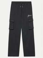 Guess Spodnie dresowe J4YQ13 KA6R3 Czarny Relaxed Fit. Czarne spodnie dziewczęce Guess, z bawełny. Za 119.99 zł.