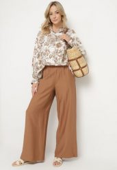 Jasnobrązowy Komplet Wiskozowy z Koszulą w Kwiaty i Szerokimi Spodniami Hanalore. Brązowe koszule damskie Born2be, l, bez wzorów, z materiału, eleganckie, bez kołnierzyka, bez ramiączek. Za 129.99 zł.