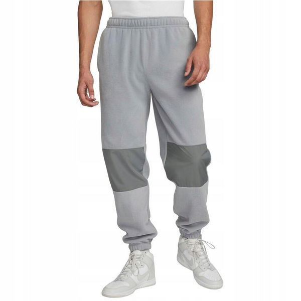 Męskie Spodnie Do Biegania Club Fleece. Szare spodnie materiałowe męskie Nike, bez wzorów, z bawełny. Za 338.99 zł.