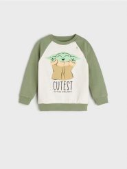 Bluza Baby Yoda - kremowy. Białe bluzy i bluzki niemowlęce Sinsay, bez wzorów, z bawełny, bez ramiączek, długie, bez kaptura. Za 15.99 zł.