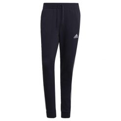 Spodnie męskie adidas Essentials Tapered Cuff 3 Stripes. Białe spodnie sportowe męskie Adidas, z bawełny. Za 163.99 zł.