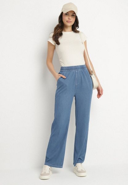 Niebieskie Szerokie Spodnie z Wiskozą Bawełną Wysokim Stanem Imitujące Jeans Caldexis. Niebieskie jeansy damskie Born2be, z podwyższonym stanem. Za 79.99 zł.
