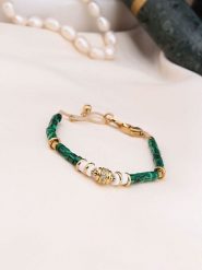 Charlize Pozłacana bransoletka z malachitami rozmiar: onesize. Zielone bransoletki damskie Charlize, pozłacane. Za 100.52 zł.