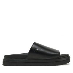 Klapki Calvin Klein Jeans. Czarne klapki damskie Calvin Klein Jeans, bez wzorów, z jeansu, bez obcasa. Za 309.99 zł.
